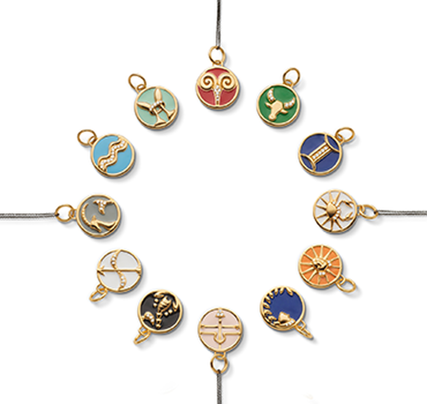 A circle of Monica Rich Kosann Zodiac necklaces.
